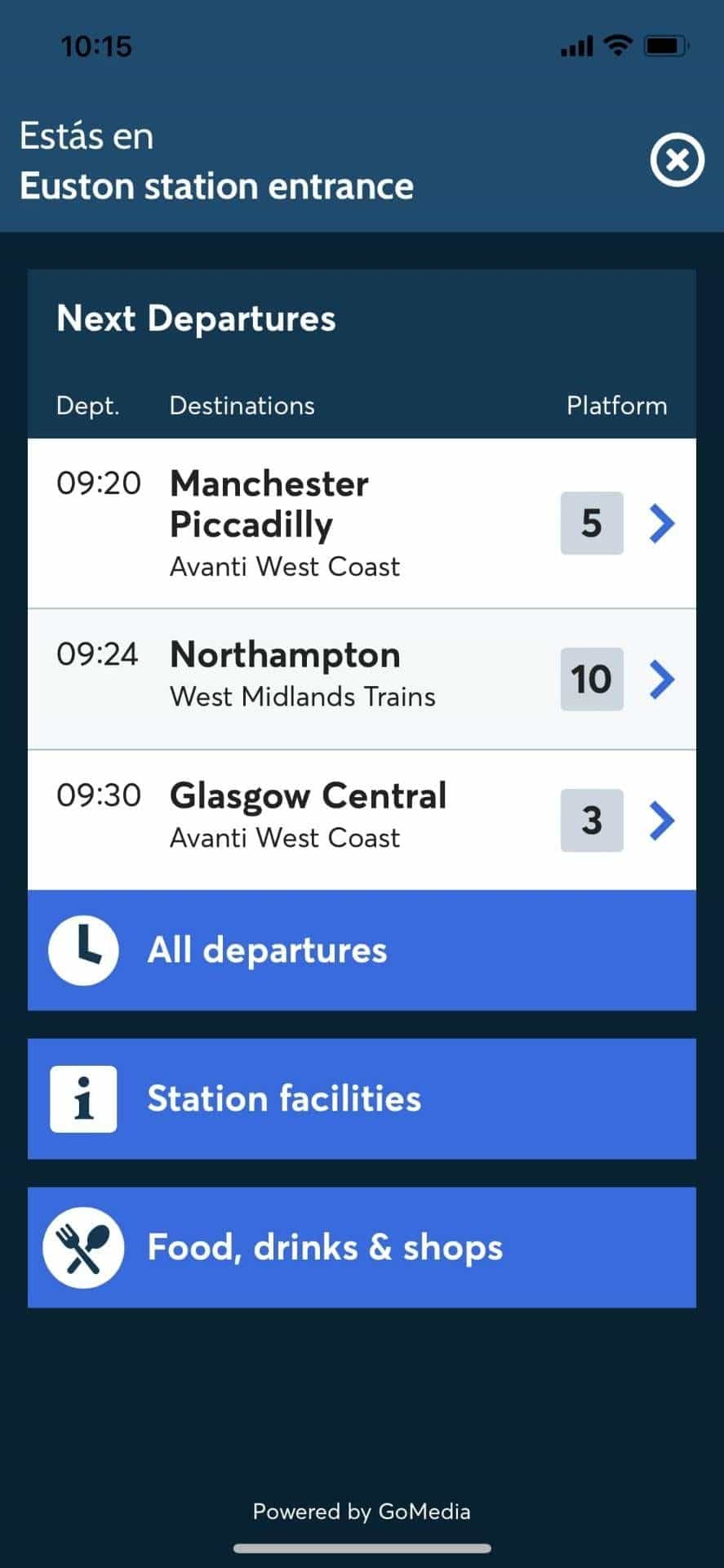 Wayfinding app main screen at Euston station entrance with live «Next Departures» (09:20 Manchester Piccadilly platform 5 — Avanti West Coast; 09:24 Northampton platform 10; 09:30 Glasgow Central platform 3). Powered by GoMedia.