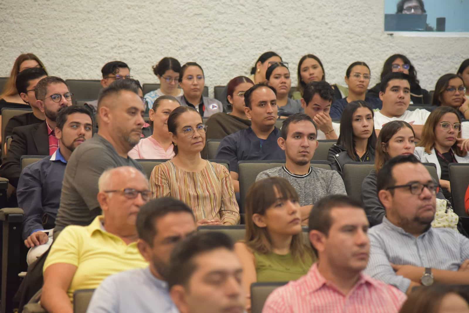 CUCS auditorium full during the NaviLens launch, with gray seats occupied by students, faculty and university staff.