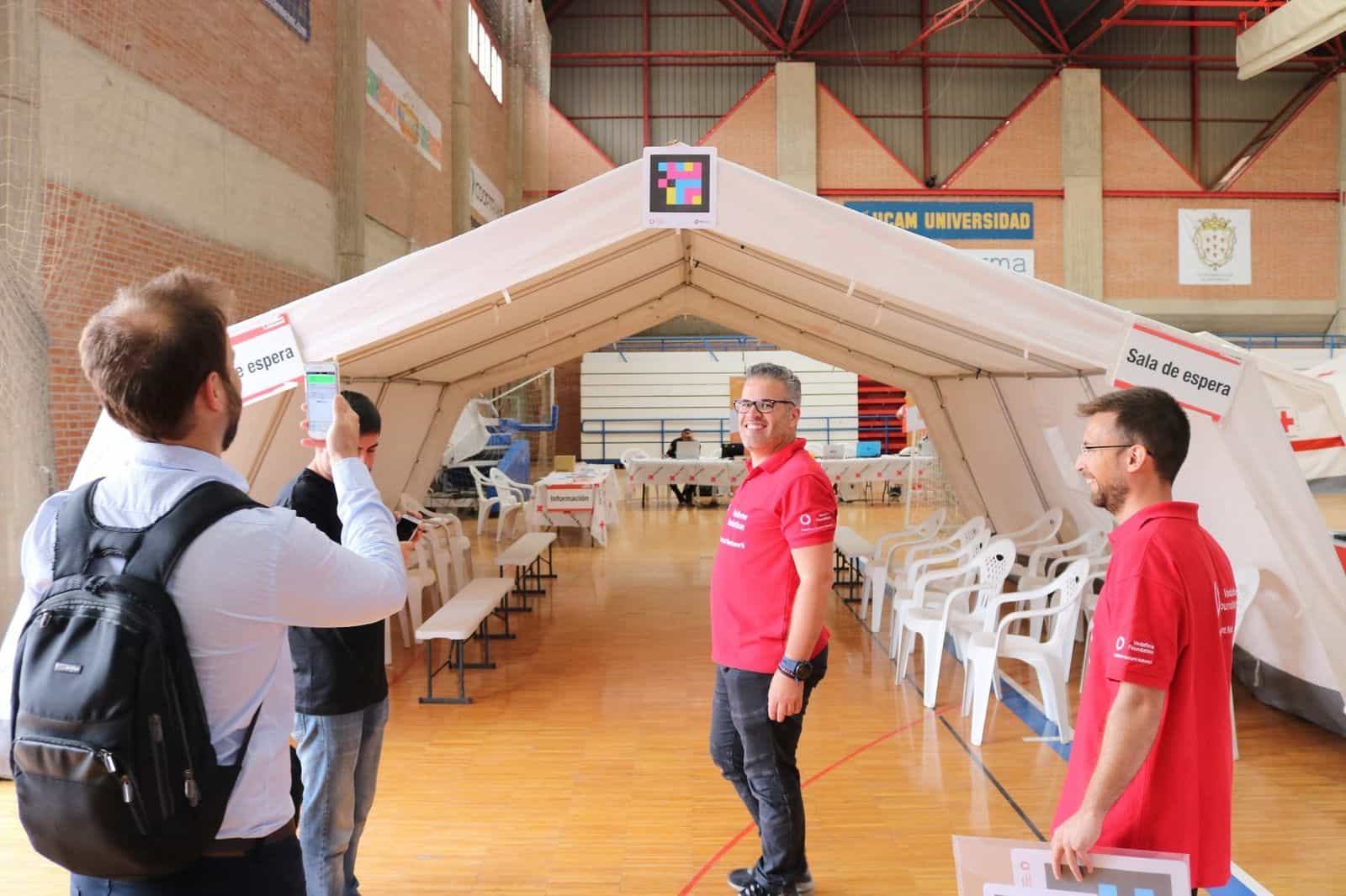 Spanish Red Cross "Waiting Area" tent with a NaviLens code hanging from the ceiling at the UME Murcia 2018 venue