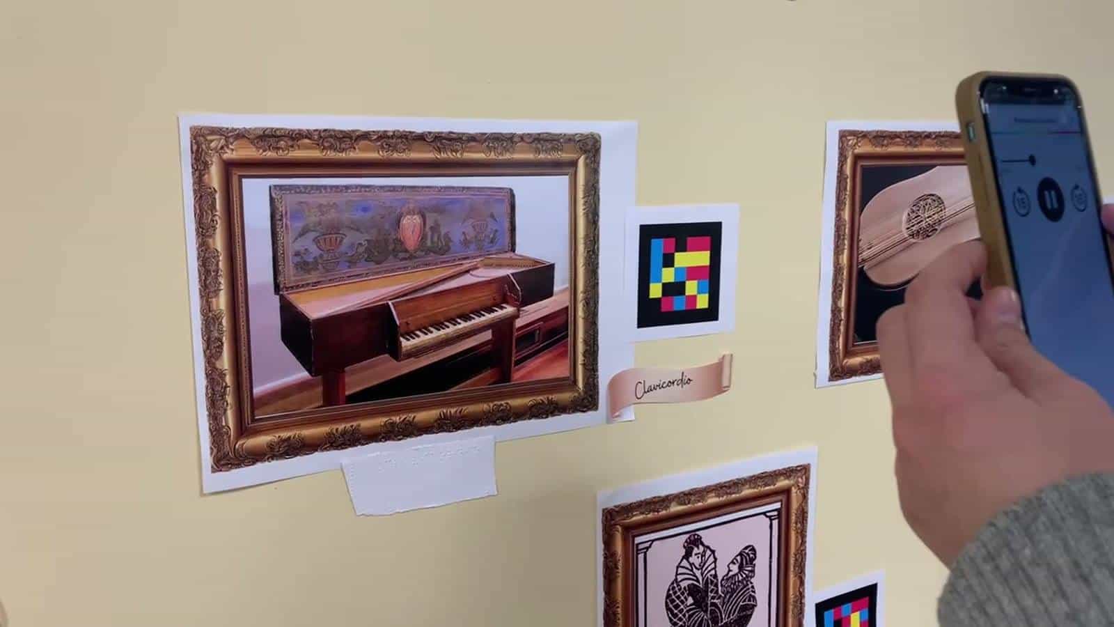 Clavichord with NaviLens marker, braille label and audio player at IES Parque Goya, Zaragoza