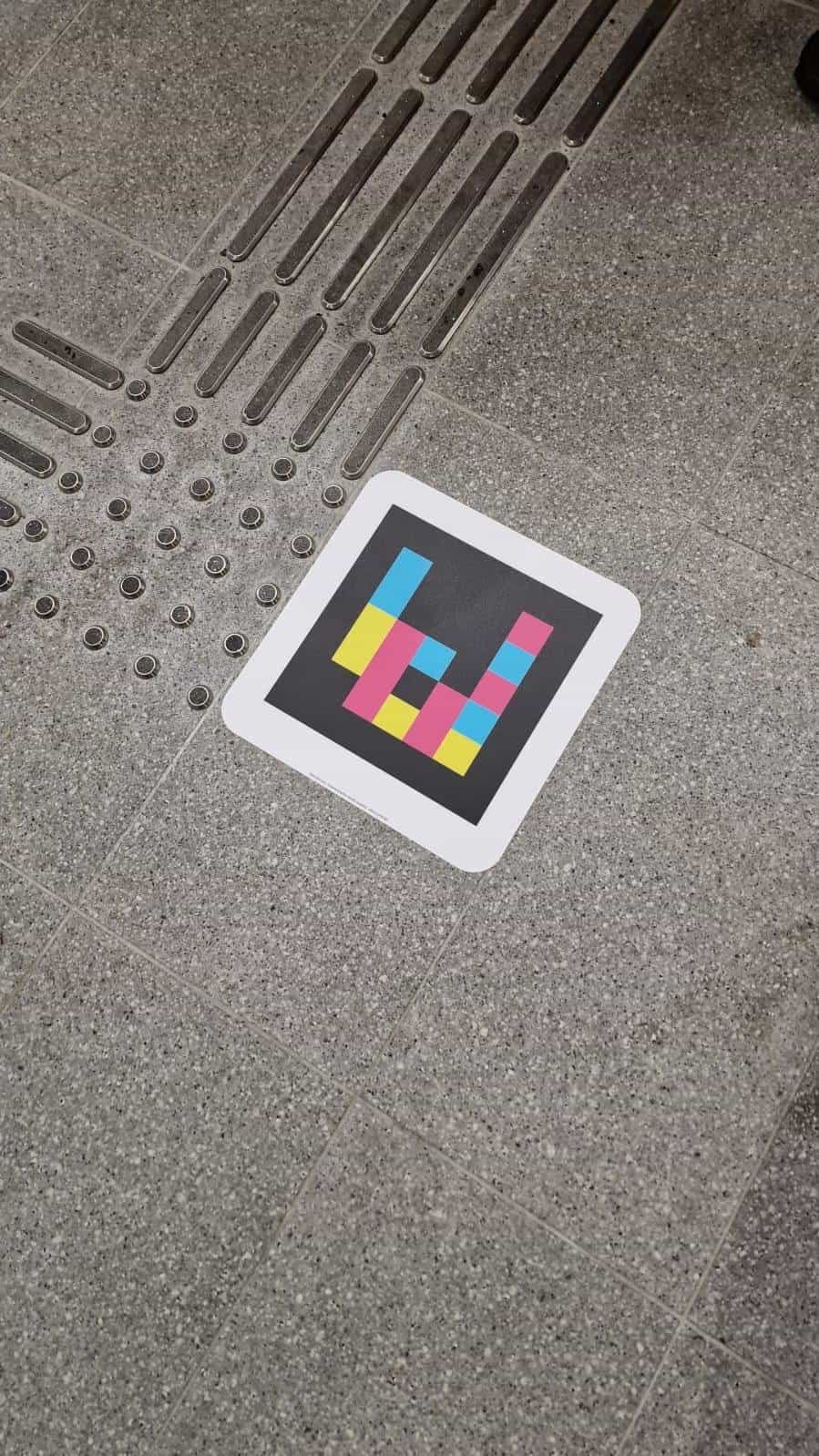 Belfast Grand Central — NaviLens code on the floor with NaviLens code