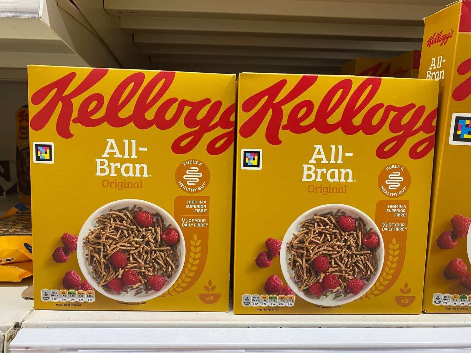 Kellogg's Corn Flakes box with a colorful square NaviLens code printed on the front