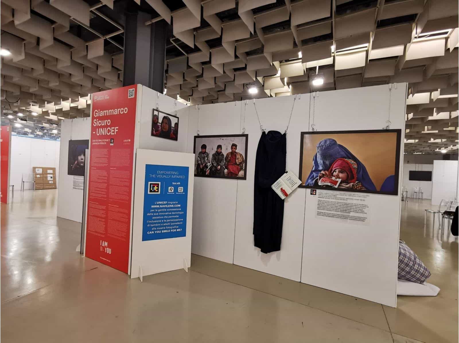 Panel of the exhibition Can you smile for me? at the Florence Biennale with NaviLens code