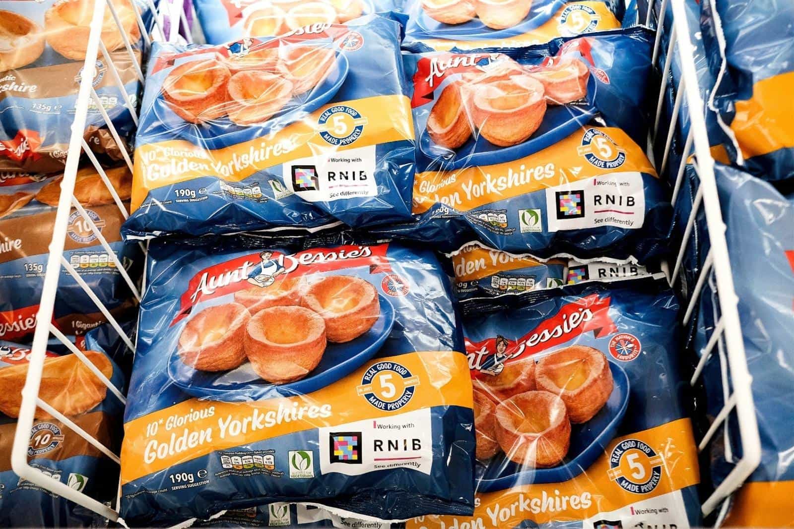 Aunt Bessie's 10 Glorious Golden Yorkshires packs showing the NaviLens code and the "Working with RNIB" seal on the front