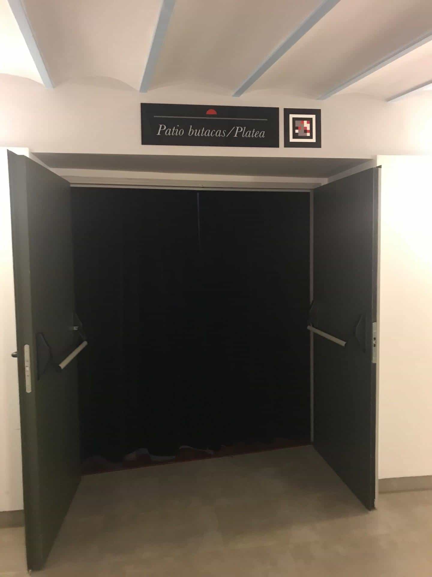Access to the stalls and seating area with a NaviLens code next to the overhead sign